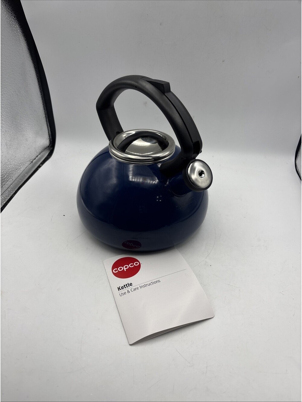 Copco enamel-on-steel whistling teakettle with a navy blue finish Check Handle